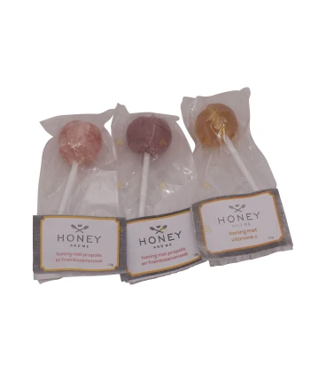 Lollipop honey with propolis and raspberry flavor